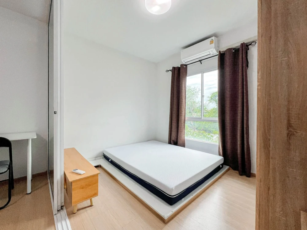 For sale: Studio unit at Unio Charan 3, featuring a partitioned bedroom. Located near the elevator with a garden view and no immediate neighbors—book
