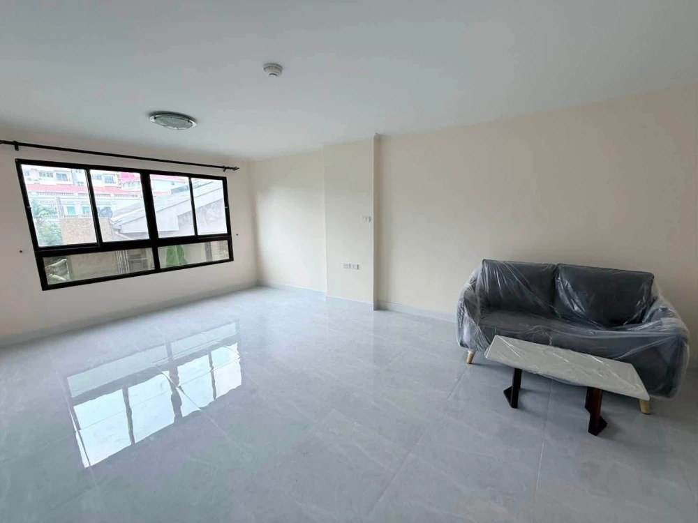 For sale: Lumpini Place Narathiwas 24. The unit is unfurnished except for one sofa. It's very clean, bright, and airy, allowing you to decorate it to