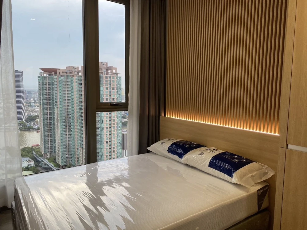 For sale or rent: Rhythm Charoenkrung Pavilion. Very high floor unit with Chao Phraya River view. Beautifully decorated. Don't miss out!