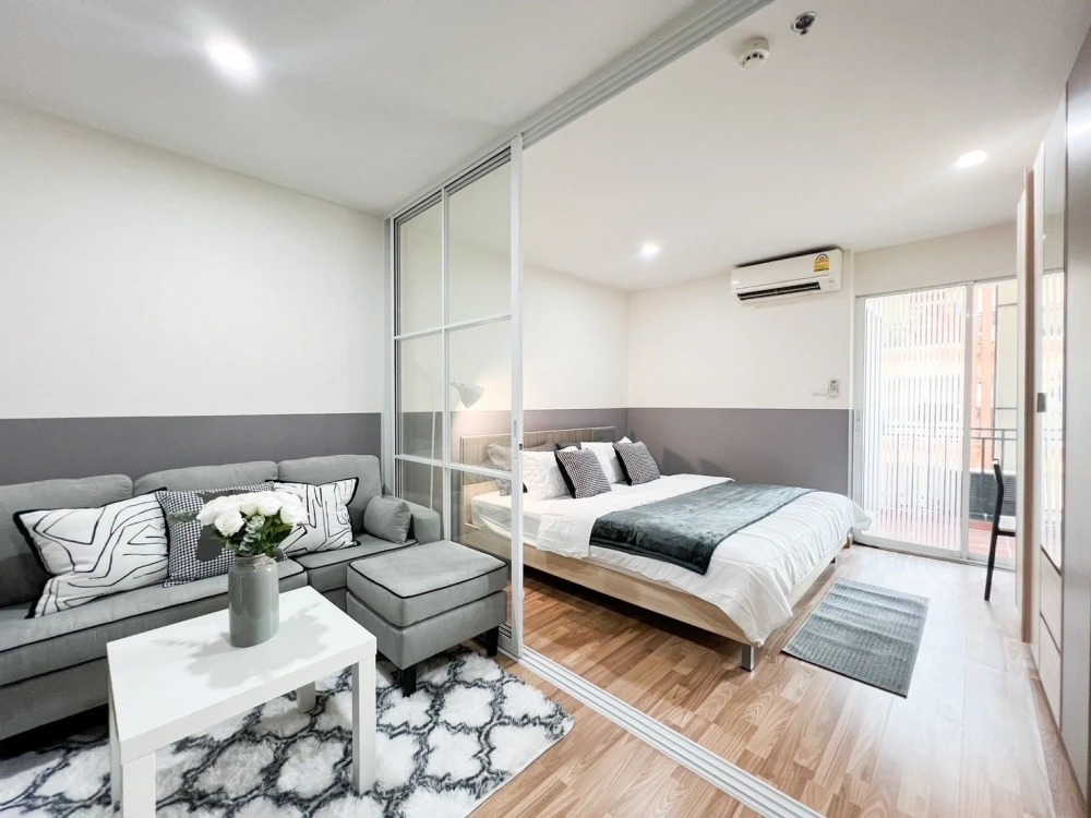 For sale or rent: Regent Home 12 Ladprao 41. The unit is on the 6th floor, next to the elevator, fire escape, and garbage room. It's very breezy; even