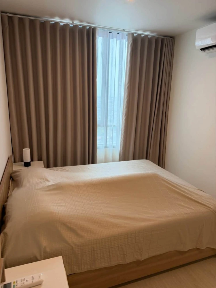 For Sale: Nue Noble Chaengwattana. Unit located near the elevator on the 26th floor, offering high-rise views. Features built-in furnishings and is re
