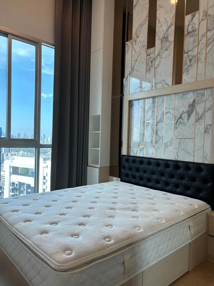 For rent: Noble Revolve Ratchada, top-floor penthouse with unobstructed panoramic views and stunning built-in furnishings. Don't miss out!