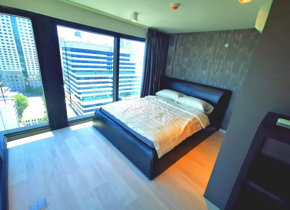 Condo for rent at The Lofts Silom. Spacious unit with ample living space and complete amenities. Move in soon!