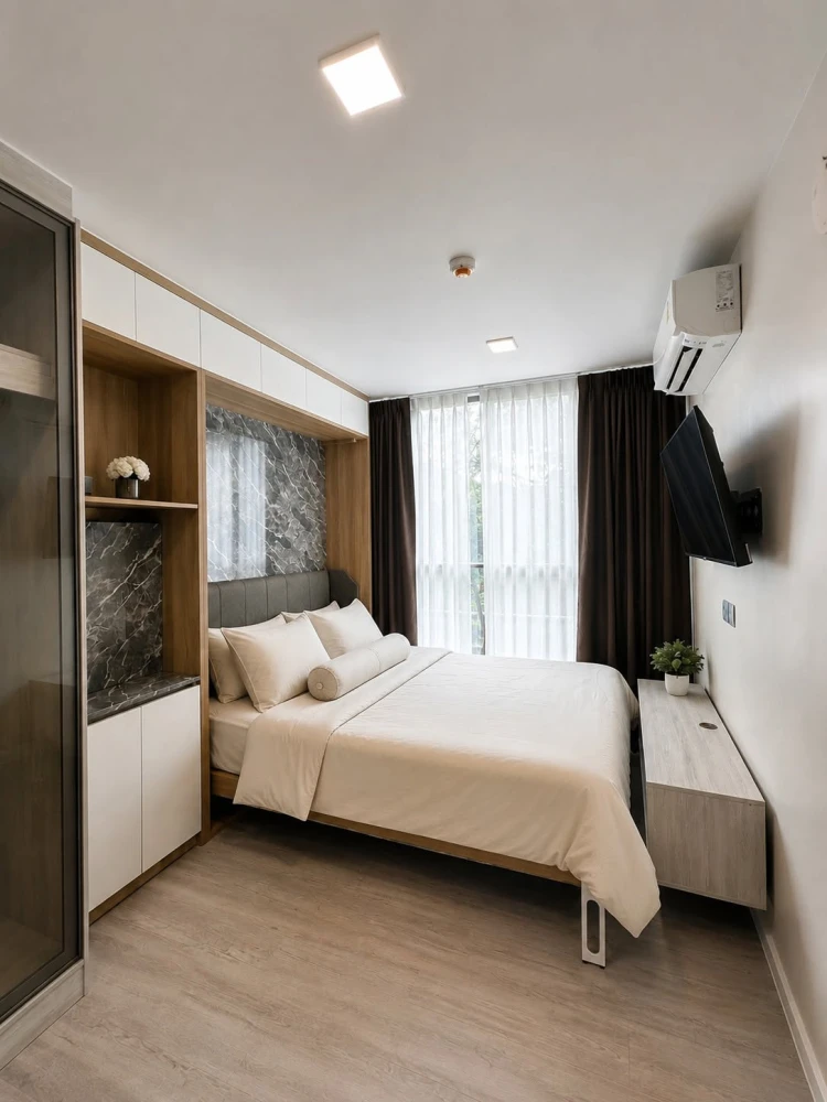 For rent: Atmoz Tropicana Bangna condo, corner unit, tree-lined view, private, quiet, and well-ventilated. Book now!