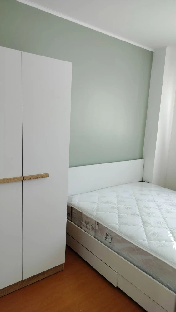 For rent: Lumpini Condo Town Ramintra-Nawamin, Building C, on Ramintra Road, 21st floor, very high, room in a soothing green tone, very livable.