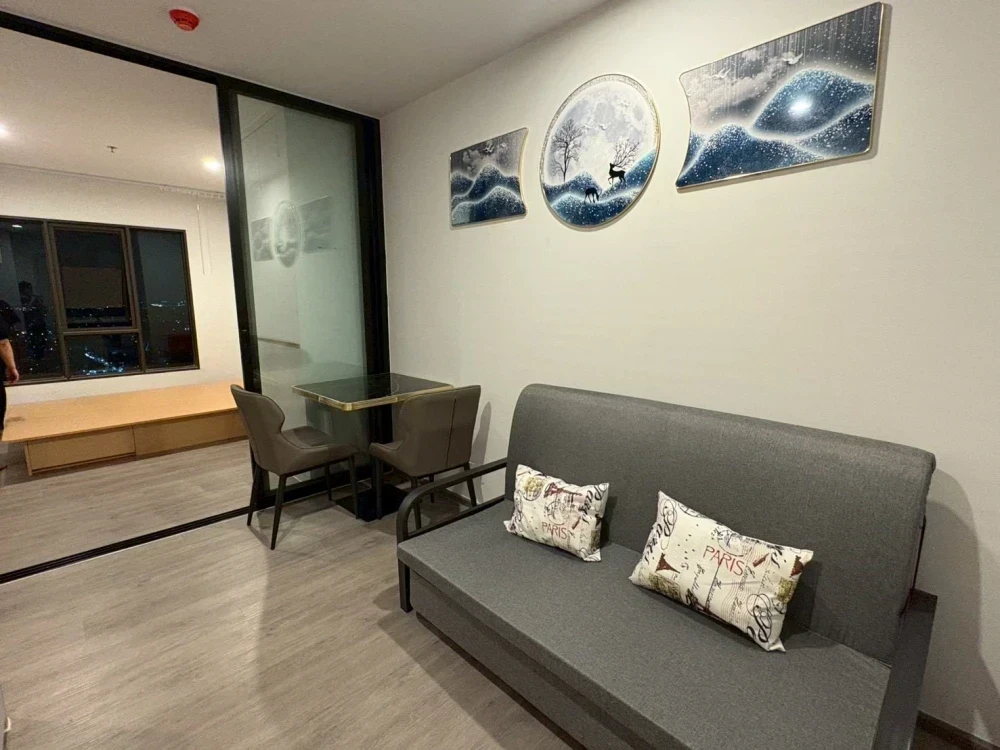 For rent: Regent Home Watthakat. The room features built-in furniture, a glass partition, and appliances. Book now!