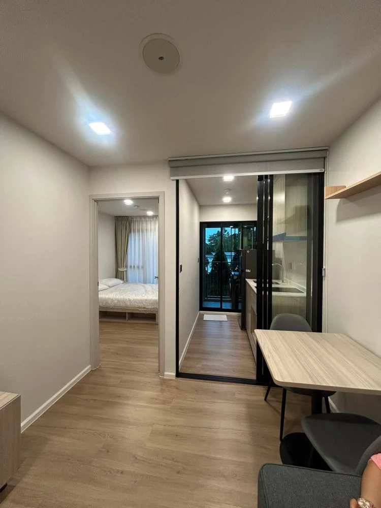 For rent: Atmoz Flow Minburi, Building B, 2nd floor. Exterior view, morning sun. Separate areas, fully furnished with appliances. Don't miss out!