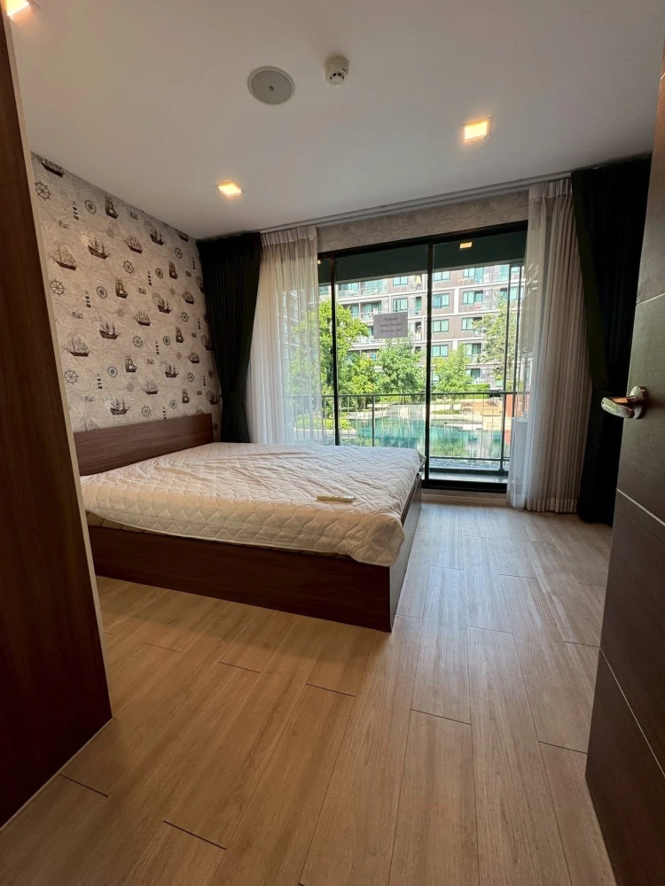For rent: Atmoz Ladprao 71, 2 bedrooms, spacious living area, beautiful wallpaper, fully furnished. Book now!