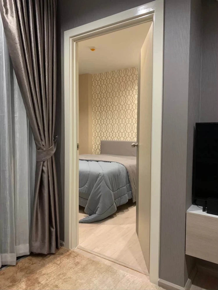 For rent: Dcon Prime Rattanathibet. A lovely unit with high-quality wallpaper and built-in furniture. Don't miss out!