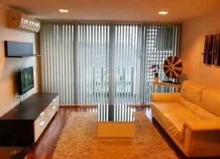 Modern 2-bedroom apartment for rent at DLV Thonglor. Spacious living room with open kitchen. You can't miss this!