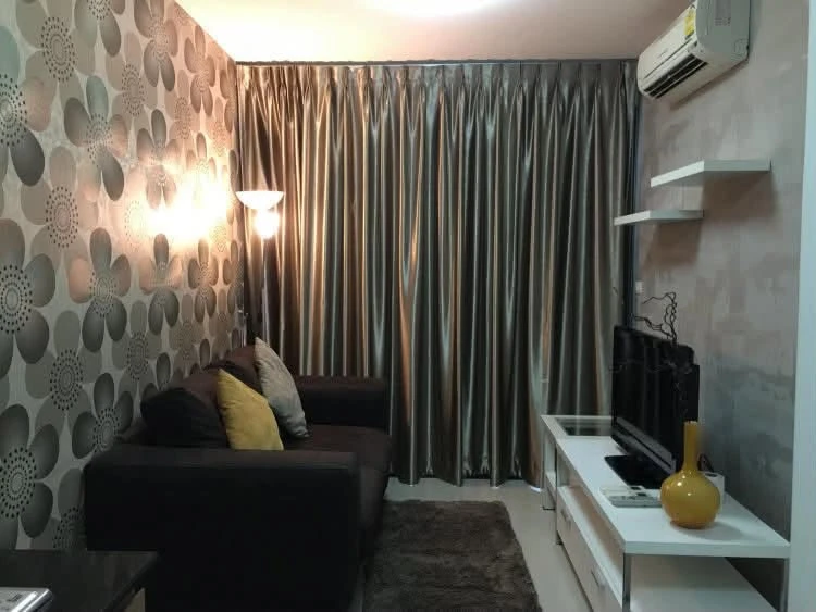 For rent: Ideo Ladprao 17. Spacious and comfortable room with high-quality wallpaper and a relaxing pool view. You definitely need to book this one!