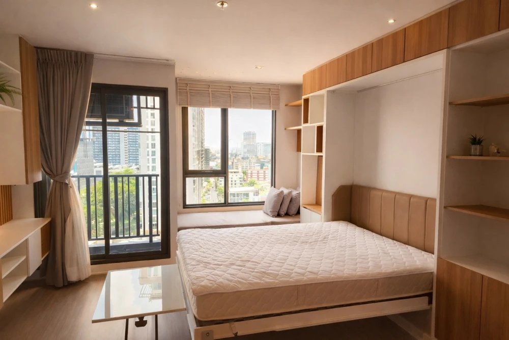 For rent: Life Ladprao condo with multi-functional furniture. The well-designed furniture maximizes space, making the room feel spacious, airy, and in
