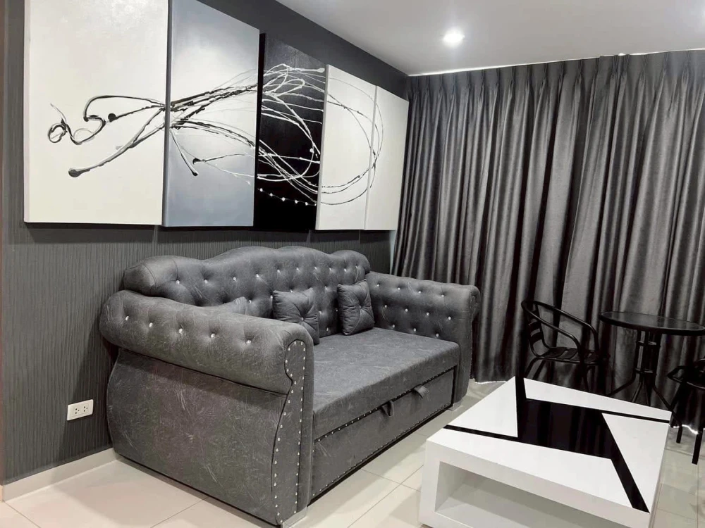 For rent: The Vision, a comfortable room with a large sofa for sitting and a sea view. If it's this good, what are you waiting for?