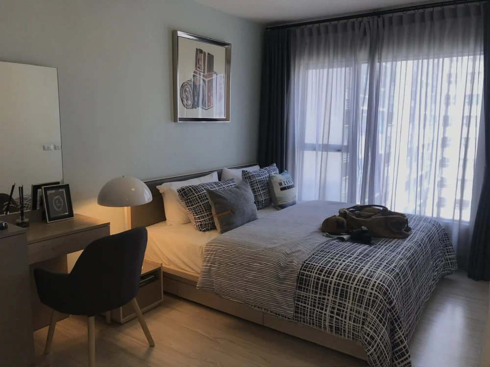For rent: Aspire Rattanathibet 2, spacious 2-bedroom unit with ample living space, beautifully decorated in a coordinated color scheme. Book now!
