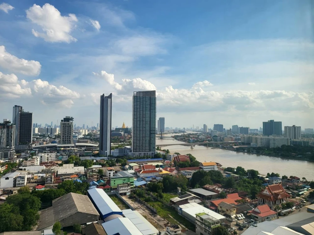 For Sale: Chapter One Shine Bangpo. Features stunning, unobstructed Chao Phraya River and city views from a very high floor. Comes fully furnished—an