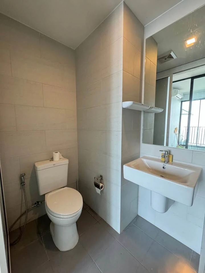 Selling a 1 Bed Plus corner unit in Notting Hill Leamchabang, located in the right building at the front of the condo, with a view of Kasetsart Univer