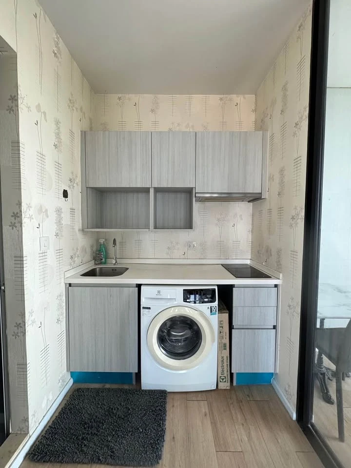 Selling a 1 Bed Plus corner unit in Notting Hill Leamchabang, located in the right building at the front of the condo, with a view of Kasetsart Univer
