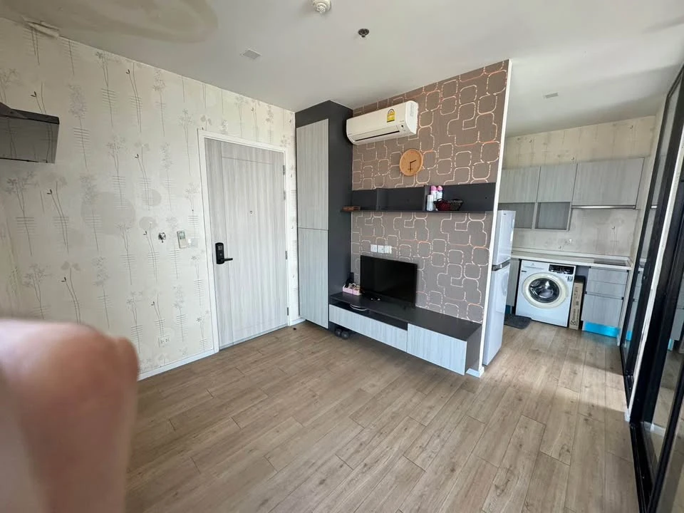 Selling a 1 Bed Plus corner unit in Notting Hill Leamchabang, located in the right building at the front of the condo, with a view of Kasetsart Univer