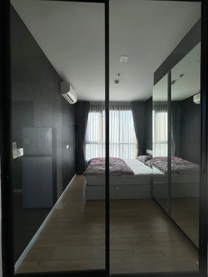 Selling a 1 Bed Plus corner unit in Notting Hill Leamchabang, located in the right building at the front of the condo, with a view of Kasetsart Univer