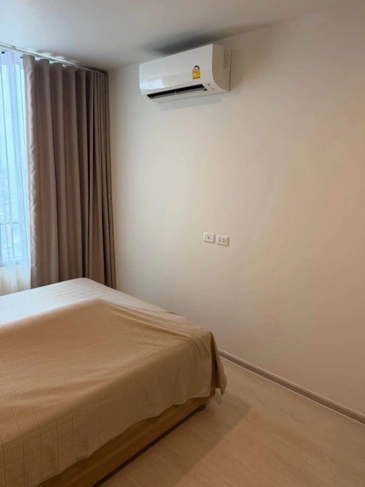 For Sale: Nue Noble Chaengwattana. Unit located near the elevator on the 26th floor, offering high-rise views. Features built-in furnishings and is re
