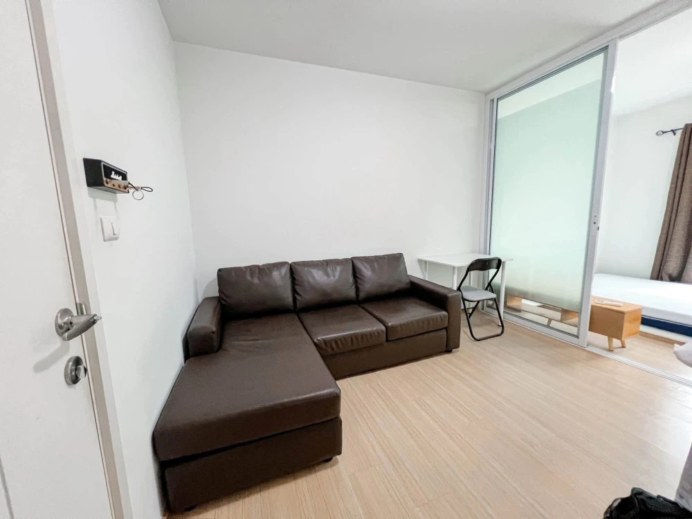 For sale: Studio unit at Unio Charan 3, featuring a partitioned bedroom. Located near the elevator with a garden view and no immediate neighbors—book