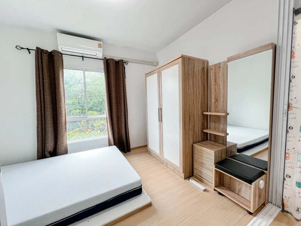 For sale: Studio unit at Unio Charan 3, featuring a partitioned bedroom. Located near the elevator with a garden view and no immediate neighbors—book