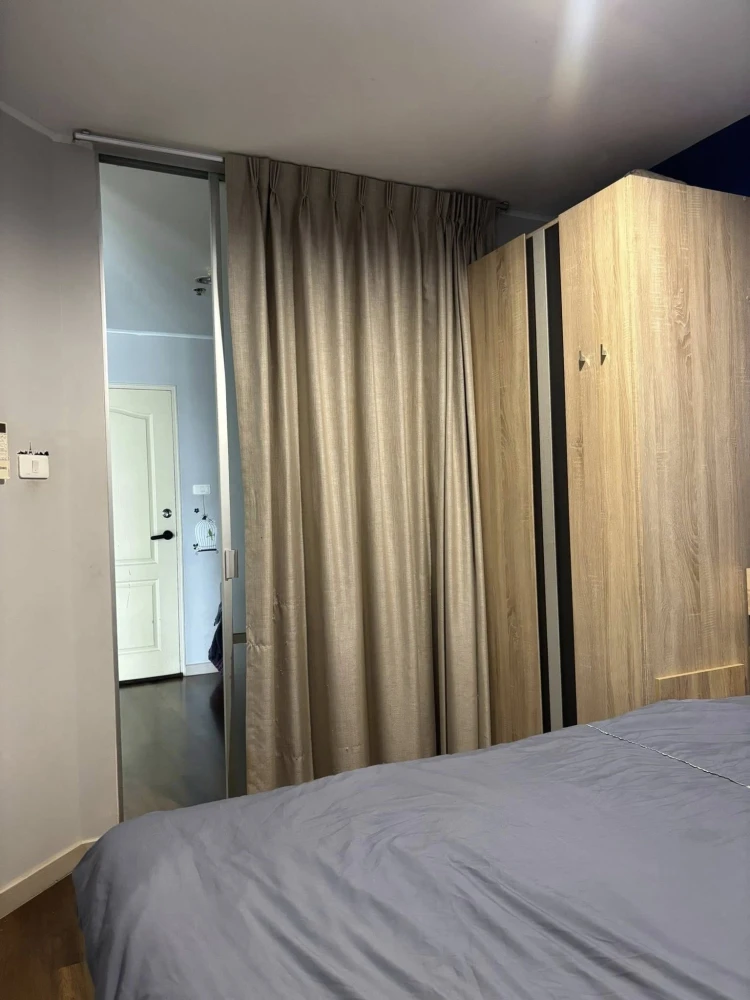 For sale: Lumpini Condo Town Ramintra - Nawamin, Building C, 15th floor, dark blue room, looks calm and inviting to relax. Hurry and book before you m