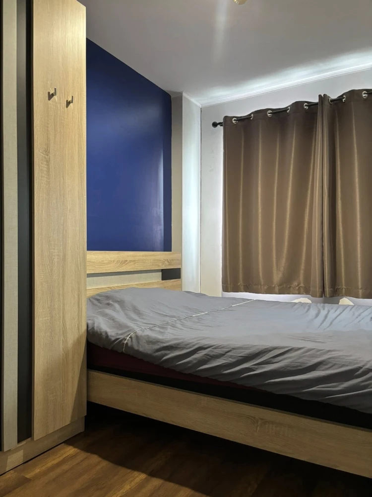 For sale: Lumpini Condo Town Ramintra - Nawamin, Building C, 15th floor, dark blue room, looks calm and inviting to relax. Hurry and book before you m
