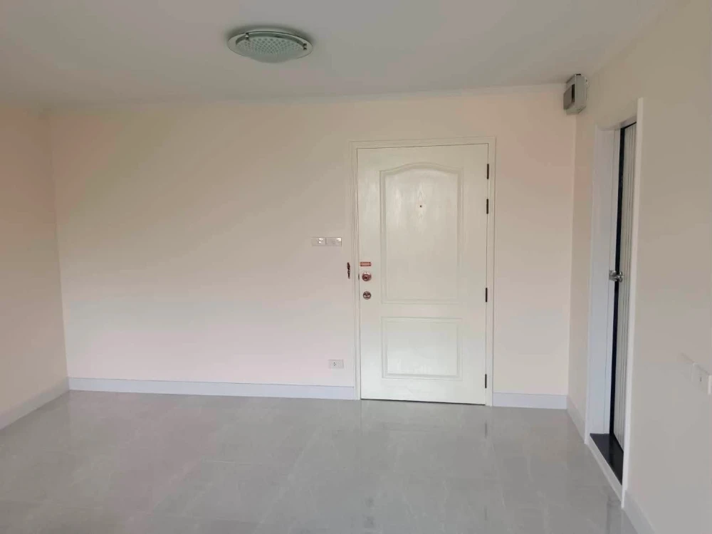 For sale: Lumpini Place Narathiwas 24. The unit is unfurnished except for one sofa. It's very clean, bright, and airy, allowing you to decorate it to