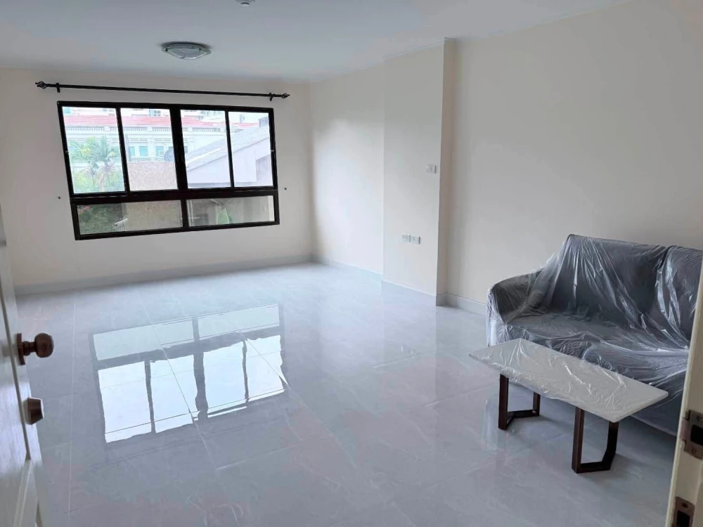 For sale: Lumpini Place Narathiwas 24. The unit is unfurnished except for one sofa. It's very clean, bright, and airy, allowing you to decorate it to