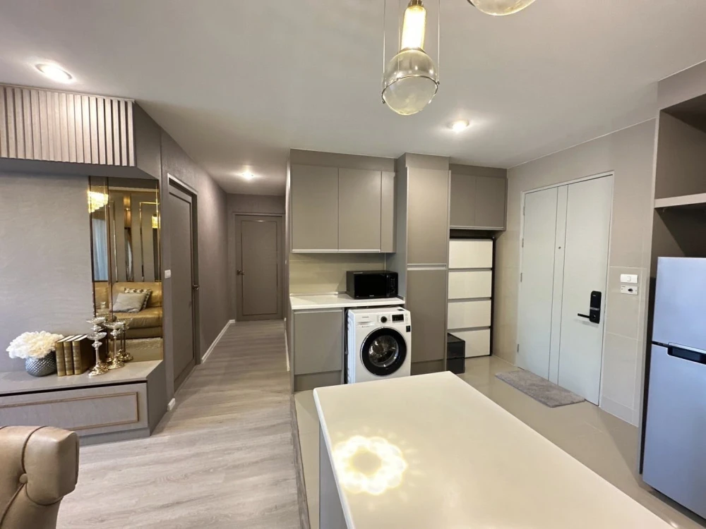 For sale or rent: Happy Condo Ladprao 101. Fully furnished unit with spacious living area, 4th floor, pool view, and large balcony. Book now!