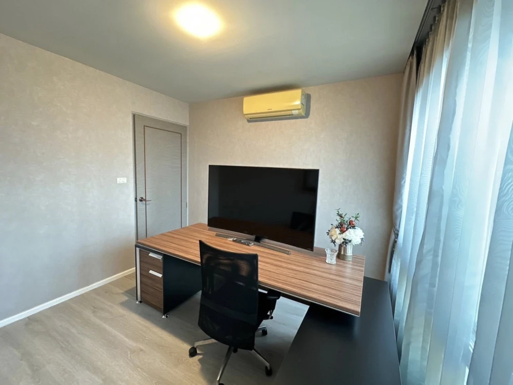 For sale or rent: Happy Condo Ladprao 101. Fully furnished unit with spacious living area, 4th floor, pool view, and large balcony. Book now!