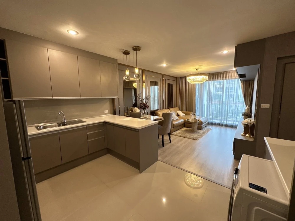 For sale or rent: Happy Condo Ladprao 101. Fully furnished unit with spacious living area, 4th floor, pool view, and large balcony. Book now!