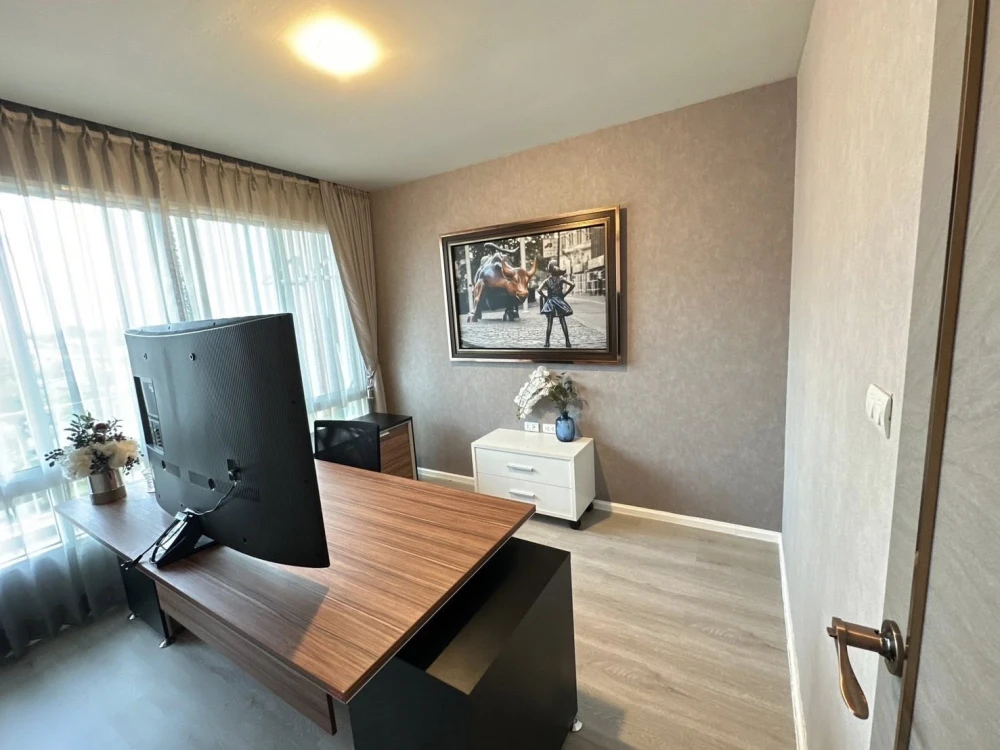 For sale or rent: Happy Condo Ladprao 101. Fully furnished unit with spacious living area, 4th floor, pool view, and large balcony. Book now!