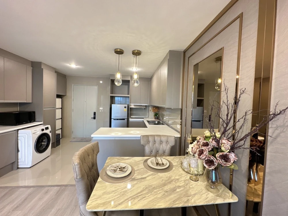 For sale or rent: Happy Condo Ladprao 101. Fully furnished unit with spacious living area, 4th floor, pool view, and large balcony. Book now!