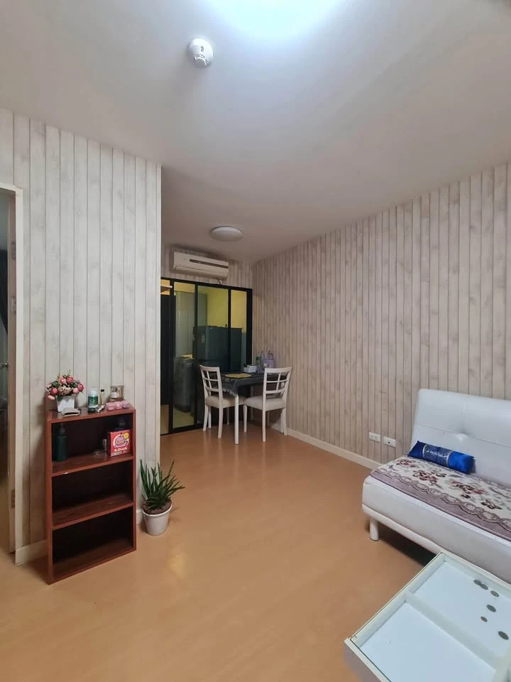 For sale: I-Condo Sukhapiban 2, with wallpaper in a very cool pattern throughout the room. The room is on the 2nd floor, next to the fire exit, defini