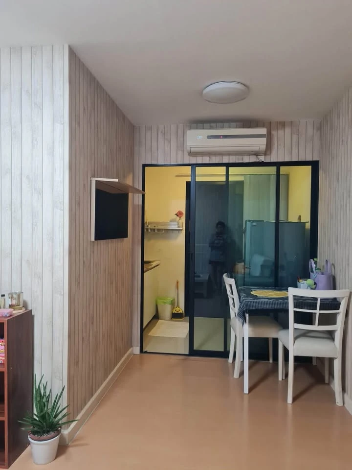 For sale: I-Condo Sukhapiban 2, with wallpaper in a very cool pattern throughout the room. The room is on the 2nd floor, next to the fire exit, defini