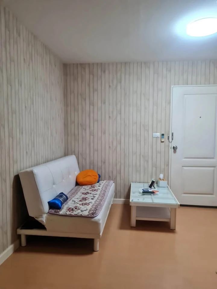 For sale: I-Condo Sukhapiban 2, with wallpaper in a very cool pattern throughout the room. The room is on the 2nd floor, next to the fire exit, defini
