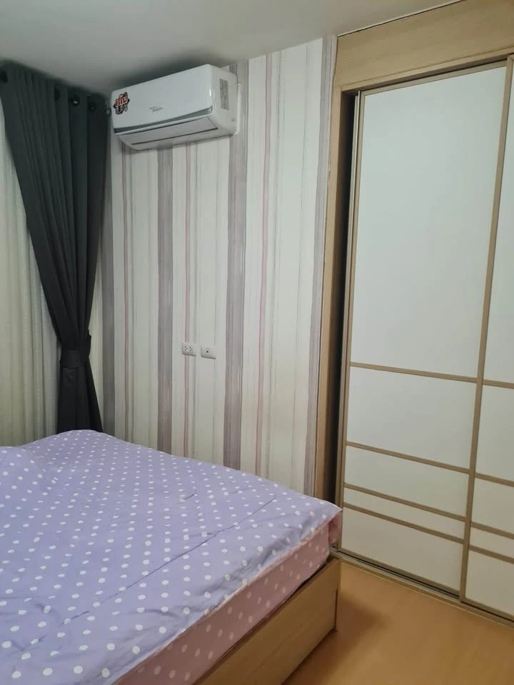 For sale: I-Condo Sukhapiban 2, with wallpaper in a very cool pattern throughout the room. The room is on the 2nd floor, next to the fire exit, defini