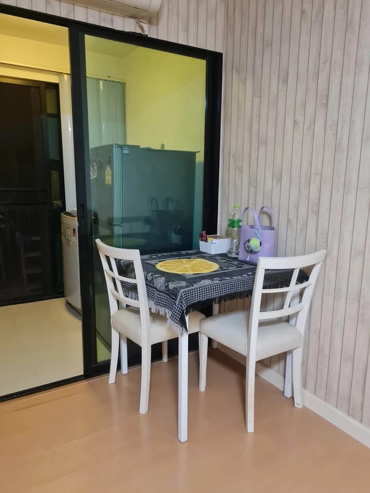 For sale: I-Condo Sukhapiban 2, with wallpaper in a very cool pattern throughout the room. The room is on the 2nd floor, next to the fire exit, defini