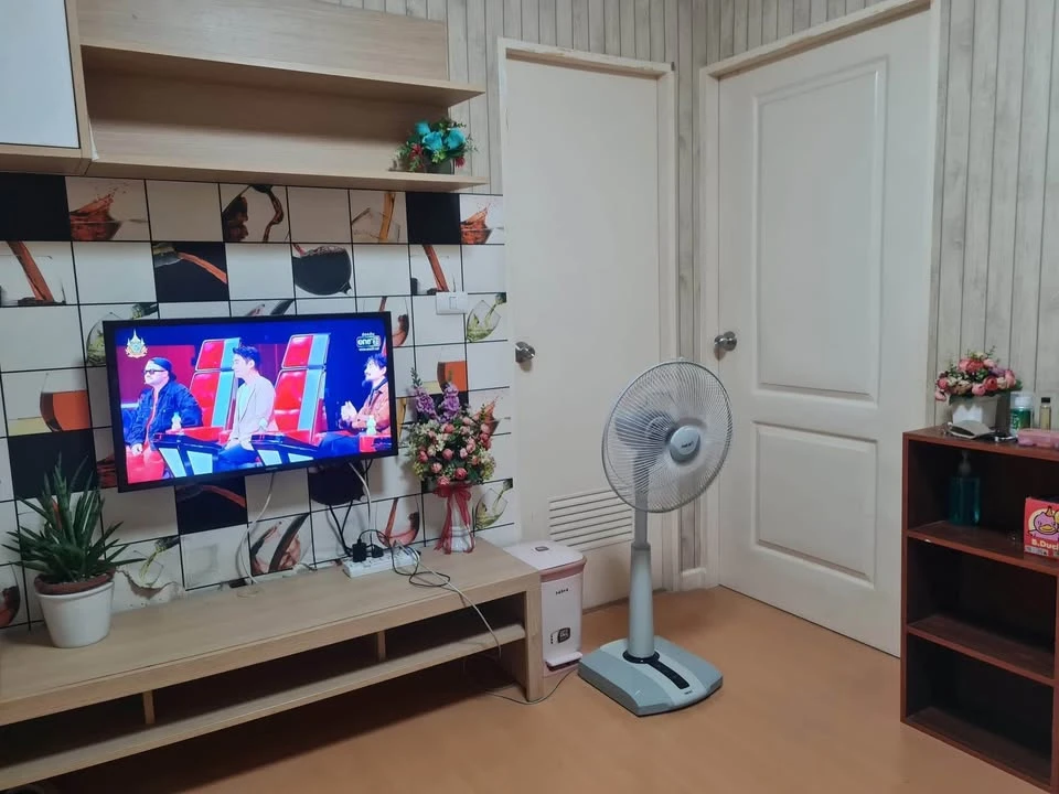 For sale: I-Condo Sukhapiban 2, with wallpaper in a very cool pattern throughout the room. The room is on the 2nd floor, next to the fire exit, defini