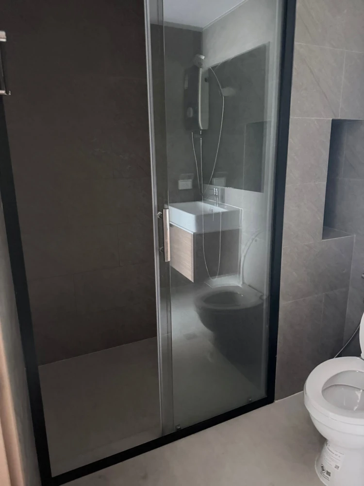 Condo for rent at The Living Ramkhamhaeng. The unit is partitioned into separate, well-defined zones. Great price! Book now!