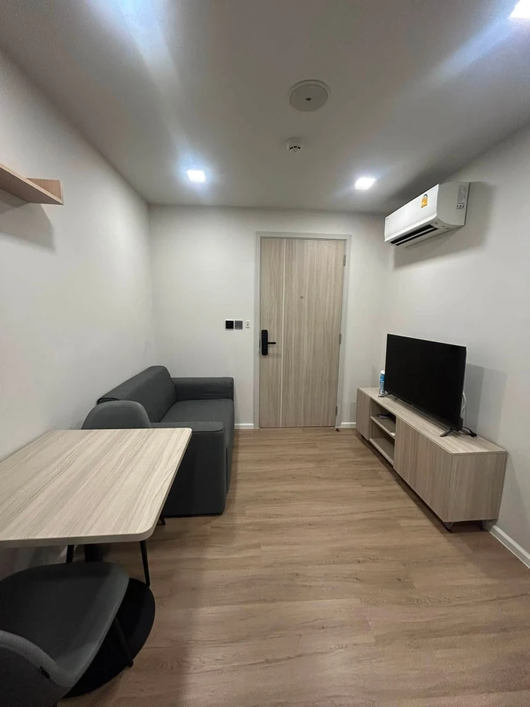 For rent: Atmoz Flow Minburi, Building B, 2nd floor. Exterior view, morning sun. Separate areas, fully furnished with appliances. Don't miss out!