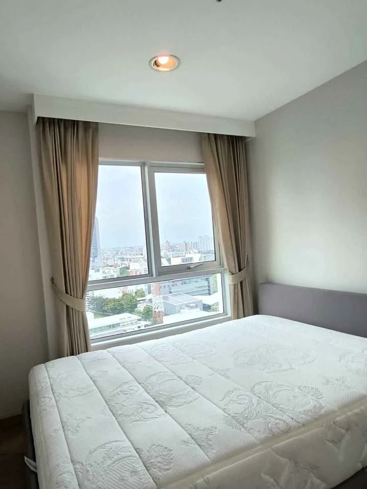 For rent: Belle Grand Rama 9, very high floor unit with view of Government Savings Bank, 2 bedrooms. Don't miss out!