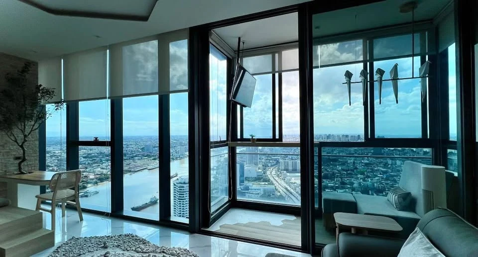 For Rent: CANAPAYA RESIDENCES—a luxury riverside condominium on the Chao Phraya River featuring a private pier. Corner units offering panoramic river