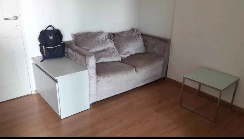 D Condo Ramkhamhaeng for rent. Features a living room, open kitchen, and balcony, along with amenities. Don't miss out!
