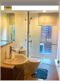 Modern 2-bedroom apartment for rent at DLV Thonglor. Spacious living room with open kitchen. You can't miss this!