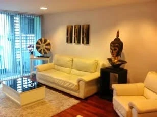 Modern 2-bedroom apartment for rent at DLV Thonglor. Spacious living room with open kitchen. You can't miss this!