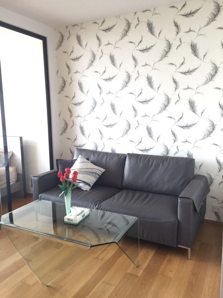 For rent: Noble Revo Silom, very high floor unit, fully furnished and ready to move in. Offers a partial view of the Chao Phraya River. Includes all a