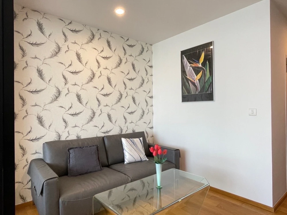 For rent: Noble Revo Silom, very high floor unit, fully furnished and ready to move in. Offers a partial view of the Chao Phraya River. Includes all a